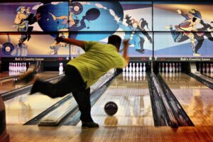 Man throwing bowling ball at Rab’s Country Lanes