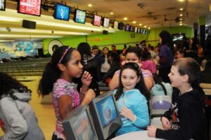 girls at bowling alley