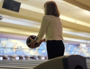 Woman about to throw bowling ball