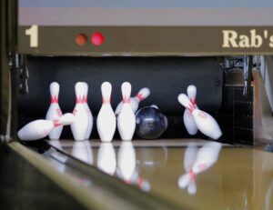 Bowling ball hitting pins