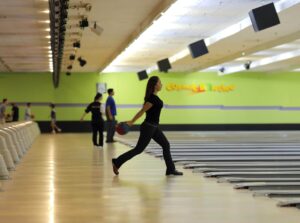 Woman bowling at Rab’s Country Lanes